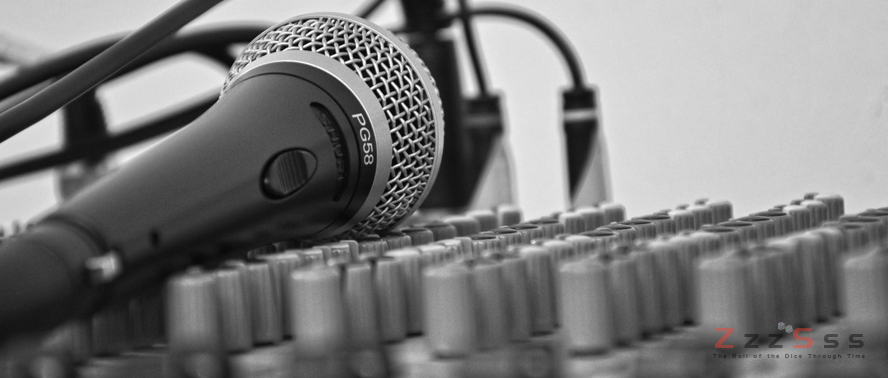 3 Must Hear Songs About Gambling black and white nicrophone with musical gadget laying - 3 Must Hear Songs About Gambling